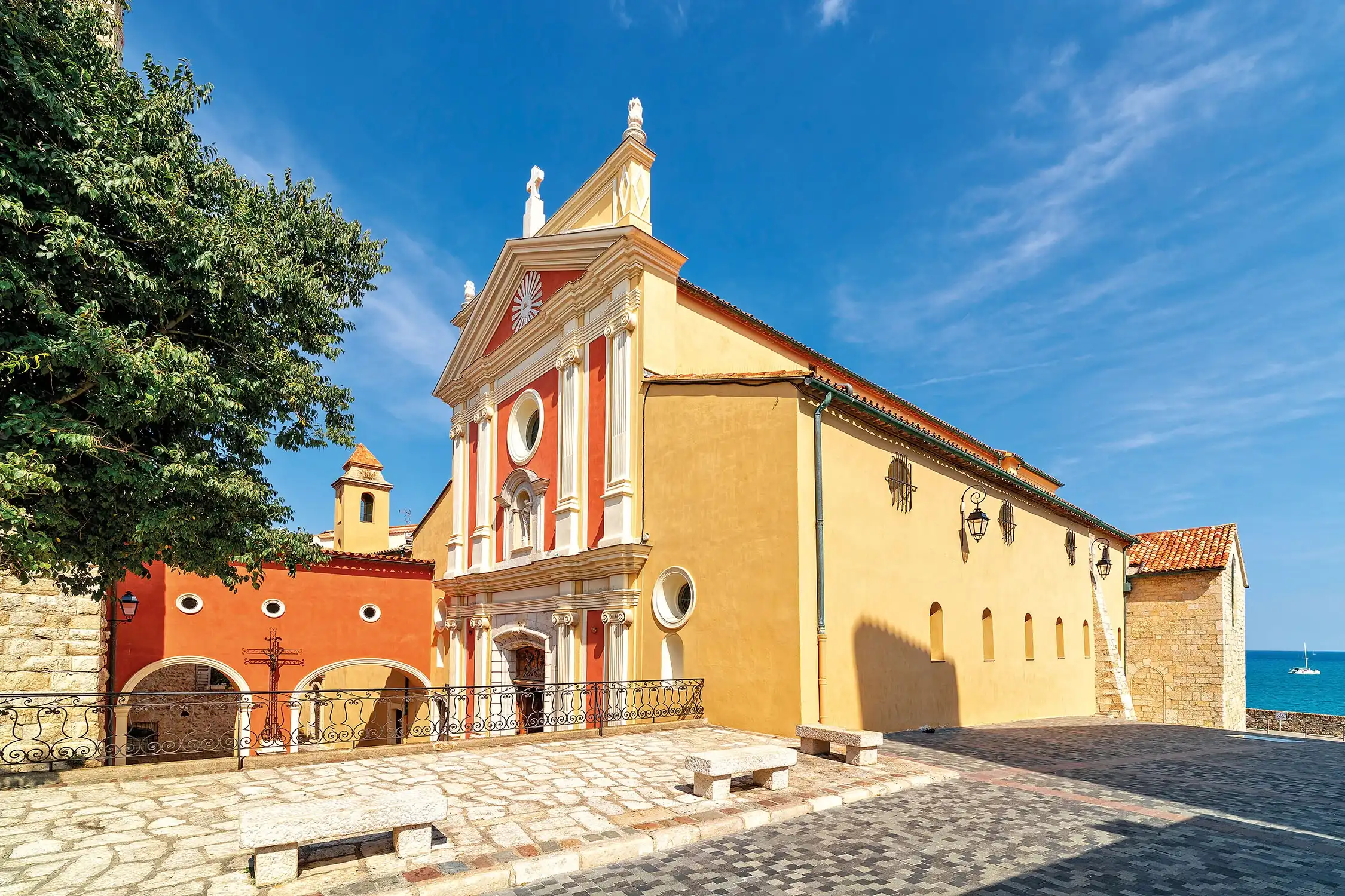Antibes Cathedral and its ochre and red façade